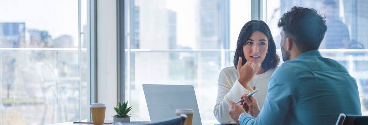 man-and-woman-having-a-discussion-in-an-office