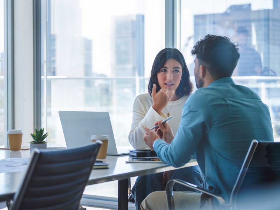 Man and woman having a discussion in an office