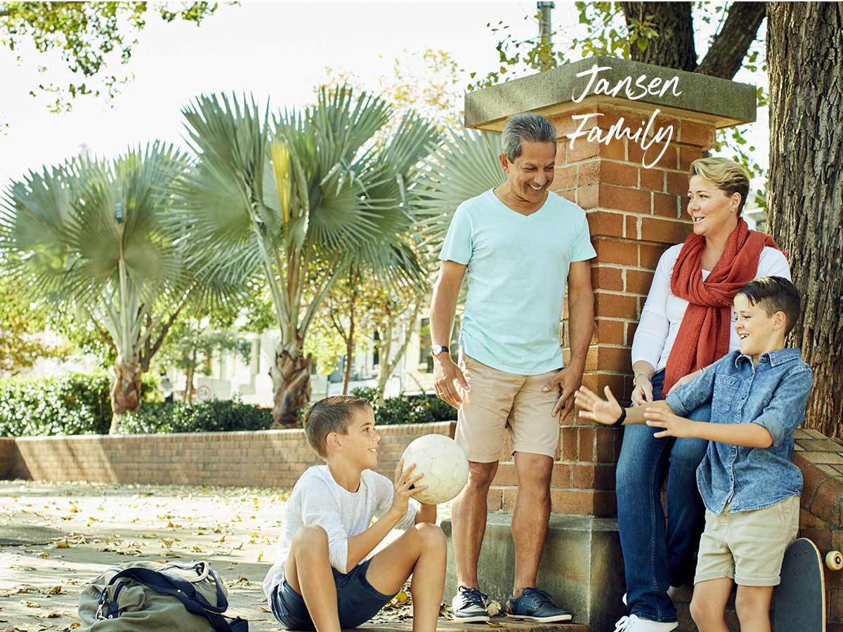 Jansen family home loan customer with kids outside in park playing and talking